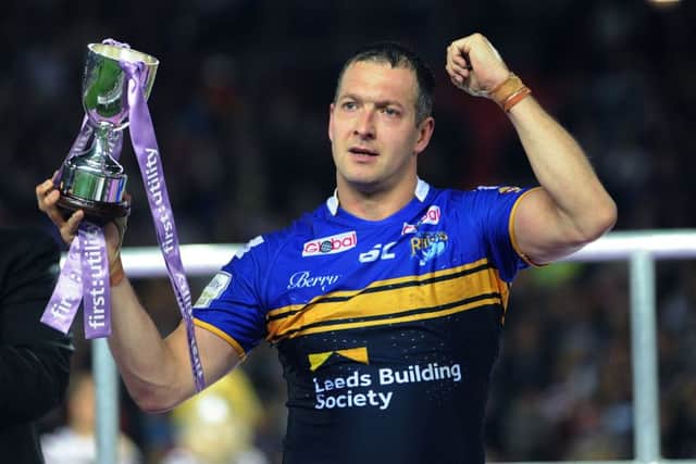 Leeds Rhinos' Danny McGuire with the Harry Sunderland trophy at the 2015 Grand Final - one of his many accolades during 399 appearances for the club.
 (Picture: Jonathan Gawthorpe)
