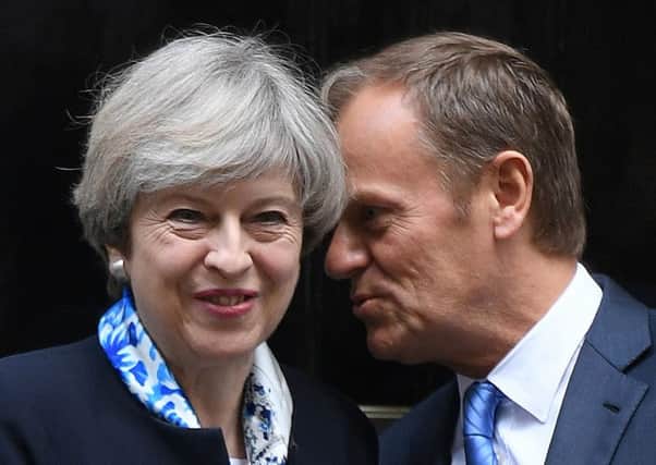 Prime Minister Theresa May greets European Council president Donald Tusk outside 10 Downing Street, London, ahead of Brexit talks.