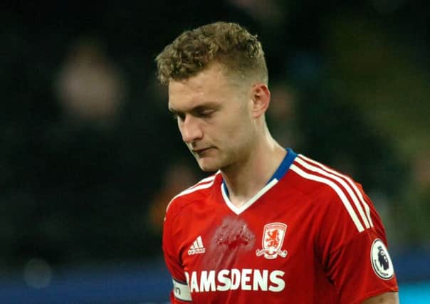 Middlesbrough captain Ben Gibson leaves the pitch after the defeat to Hull City. Picture: Tom Collins.