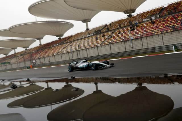 Mercedes driver Lewis Hamilton of Britain steers his car during the first practice session for the Chinese Formula One Grand Prix at the Shanghai International Circuit in Shanghai. (AP Photo/Andy Wong)