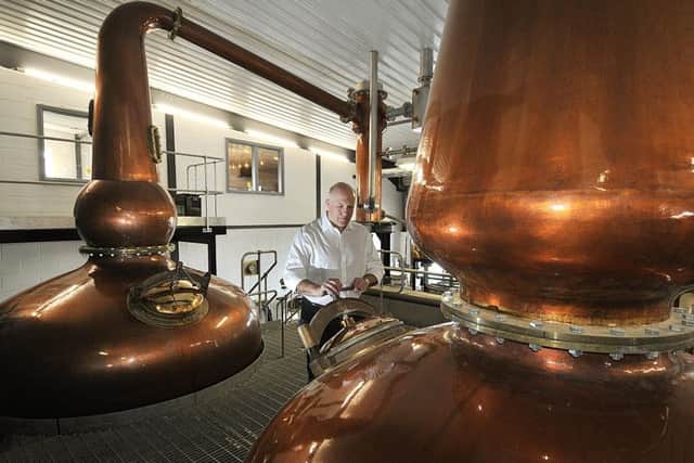 Tom Mellor in the processing area of the distillery.
