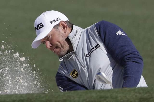 Lee Westwood, of England, hits from a bunker on the second hole during the second round of the Masters. (AP Photo/David Goldman)