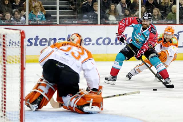 Sheffield Steelers' Zack Fitzgerald, right, tries to rein in Belfast Giants' Brandon Benedict as he bears down on goaltender Ervins Mustukovs at the SSE Arena in January this year. Picture courtesy of EIHL/William Cherry/Presseye