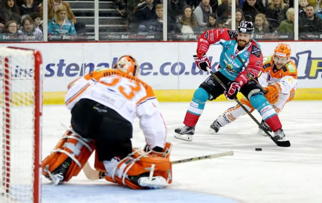 Sheffield Steelers' Zack Fitzgerald, right, tries to rein in Belfast Giants' Brandon Benedict as he bears down on goaltender Ervins Mustukovs at the SSE Arena in January this year. Picture courtesy of EIHL/William Cherry/Presseye
