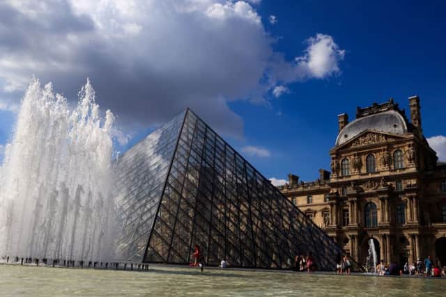 The pyramid entrance to The Louvre Museum  in Paris.