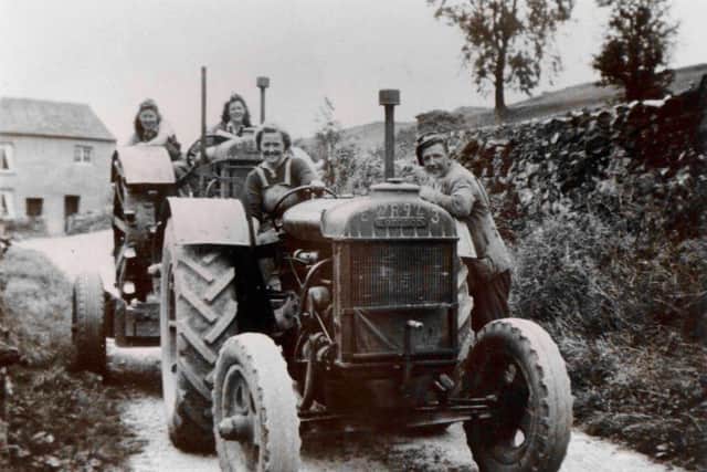 Womens Land Army volunteers helping a farmer in Ribblesdale during the Second World War.