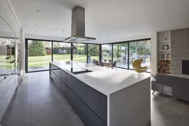 The extension, which houses a large living kitchen with units by Wren.