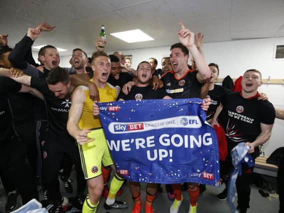 The Sheffield United squad celebrate in the dressing room