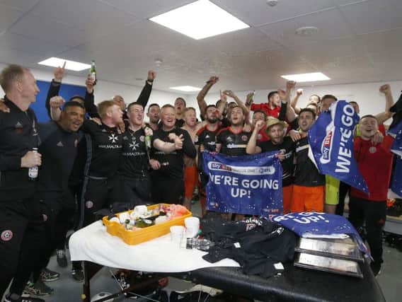 Chris Wilder and the Sheffield United squad celebrate in the dressing room