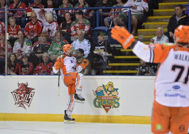 Guillaume Desbiens celebrates his fifth-minute opener for Sheffield Steelers against BElfast on Saturday. Picture: Dean Woolley.