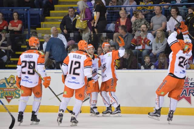 SORTED: Levi Nelson is mobbed by his Sheffield Steelers' team-mates after scoring a late empty-netter in Saturday's semi-final against Blfast. Picture: Dean Woolley.