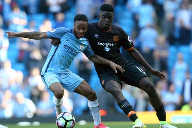 Manchester City's Raheem Sterling (left) and Hull City's Alfred N'Diaye. PIC: Dave Thompson/PA Wire