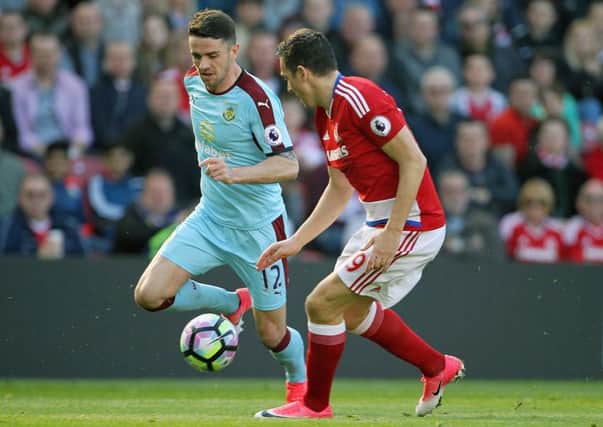Burnley's Robbie Brady (left) and Middlesbrough's Stewart Downing battle for the ball during Saturday's Premier League match at the Riverside Stadium. PIC: Richard Sellars/PA Wire