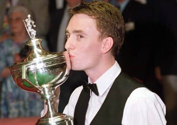 Ireland's new hero, Ken Doherty, kisses the trophy having become the new Embassy World Snooker Champion after beating six-times champion, Stephen Hendry at the Crucible in Sheffield in 1997. (Picture: Paul Barker/PA)
