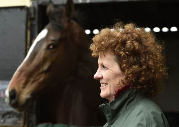 Grand National winner One For Arthur pictured with trainer Lucinda Russell at her yard in Kinross, Scotland.