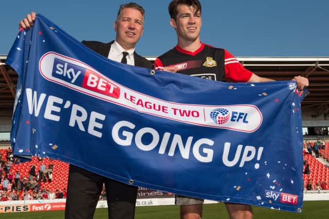 Doncaster Rovers manager Darren Ferguson celebrates promotion with John Marquis (Picture: PA)