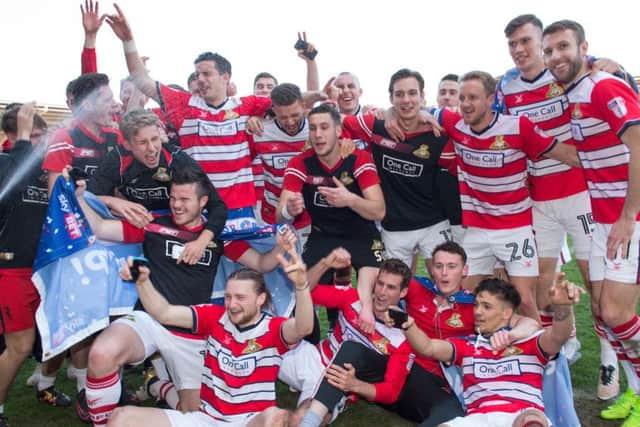 Doncaster Rovers celebrate promotion after the Sky Bet League Two match at the Keepmoat Stadium, Doncaster. (Picture: Jon Buckle/PA Wire)