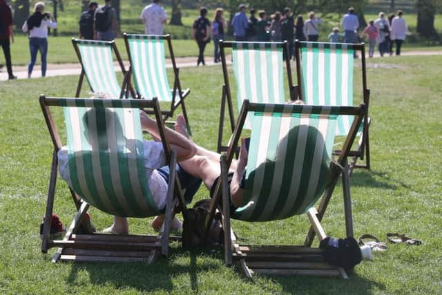 Sunniest day of the year hits Green Park, Central London, as people take to the park to soak up the sun.
