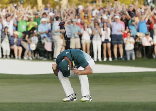 Sergio Garcia reacts after making his birdie putt on the 18th green to win the Masters in Augusta. Picture: AP Photo/David J. Phillip