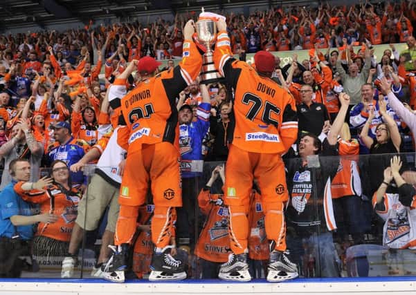 Ben O Connor and Robert Dowd celebrate with Sheffield Steelers' fans after beating Cardiff Devils in the second period of overtime. Picture: Dean Woolley.