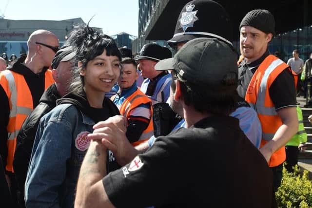 Saffiyah Khan (left) stares down English Defence League (EDL) protester Ian Crossland during a demonstration in Birmingham, as she has said she was "not scared in the slightest" during the tense confrontation.