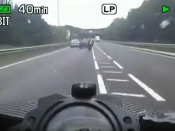 A still from the dashcam footage. (SWNS)