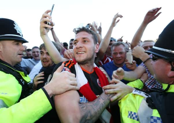 Sheffield United's Billy Sharp celebrates promotion to the Championship. Picture: David Klein/Sportimage