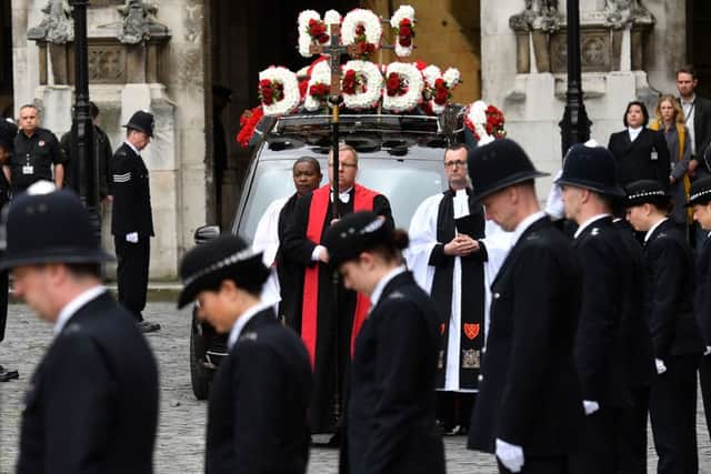 The hearse carrying the coffin of Pc Keith Palmer leaves Westminster's Chapel of St Mary Undercroft in London on its way to Southwark Cathedral