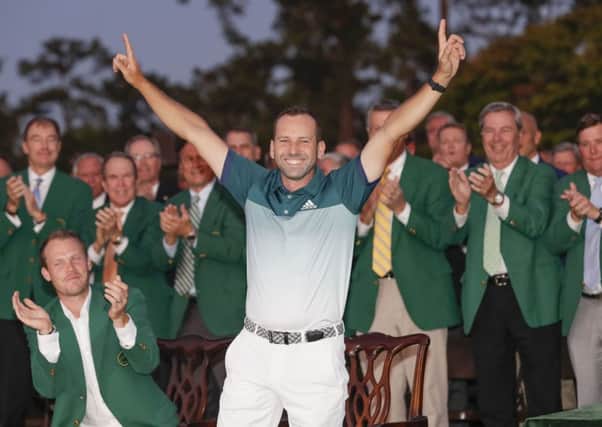 Delight: Sergio Garcia points to the skies after winning a thrilling Masters showdown, watched by 2016 champion Danny Willett, left. (Picture: AP)