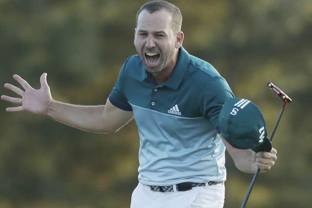 Sergio Garcia, of Spain, reacts after making his birdie putt on the 18th green to win the Masters golf tournament after a playoff Sunday. (AP Photo/Chris Carlson)