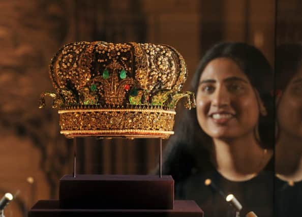Curator Kajal Mehghani with a crown presented to the Prince by the Taluqdars of Auradh in 1876 at the Splendours of the Subcontinent exhibition. Picture: Tony Johnson.