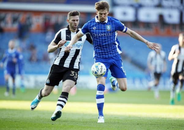 Sheffield Wednesday's Glenn Loovens gets the better of Newcastle United's Daryl Murphy (Picture: Danny Lawson/PA Wire).