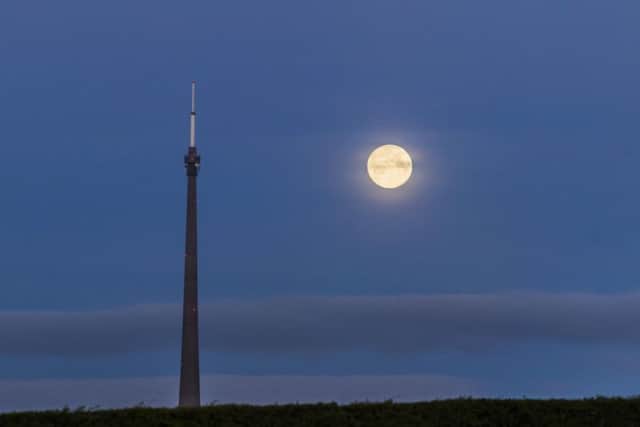 April's full moon, also known as a 'Pink Moon', is seen near Emley Moor transmitting station, a telecommunications and broadcasting facility on Emley Moor in Kirklees, West Yorkshire.
