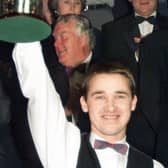 Dominant: Stephen Hendry raises the trophy after his seventh world title success. (Picture: PA)