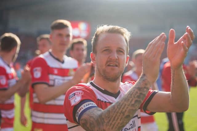 Doncaster Rovers' James Coppinger celebrates promotion after the Sky Bet League Two match at the Keepmoat Stadium, Doncaster. (Picture: PA)