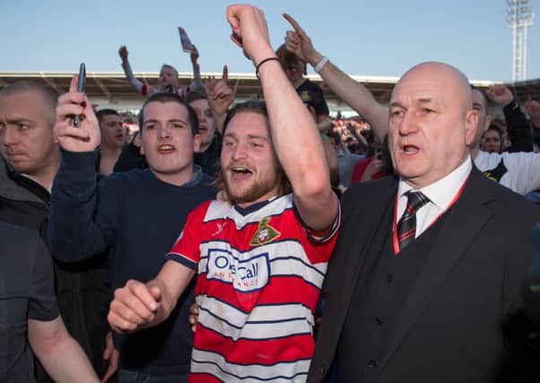 Doncaster Rovers Alfie May celebrates promotion with fans after the Sky Bet League Two match at the Keepmoat Stadium, Doncaster. (Picture: Jon Buckle/PA Wire)