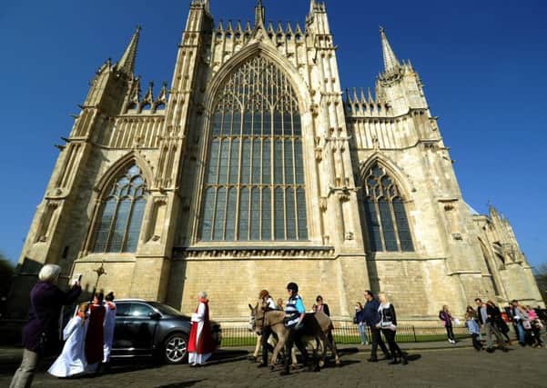 The Palm Sunday procession arrives at York Minster.
