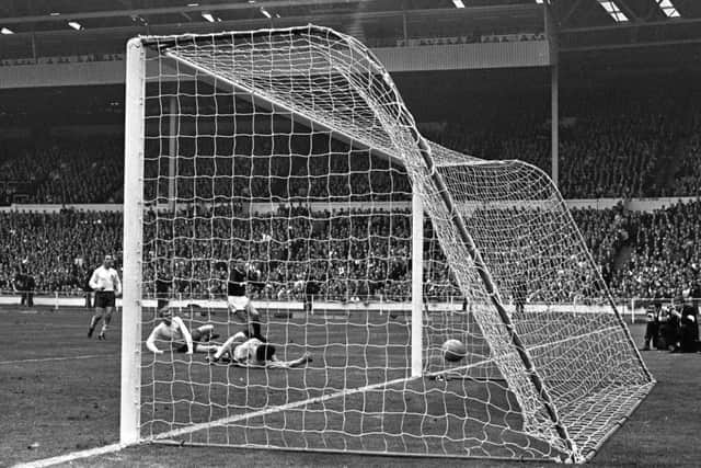 GREAT TIMING: Scotland's Jim McCalliog scores past England goalkeeper Gordon Banks for his side's third and winning goal in the international match at Wembley. Picture: PA.