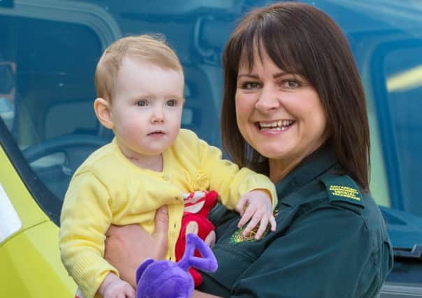 Ambulance cinician Lisa Derbyshire with Poppy