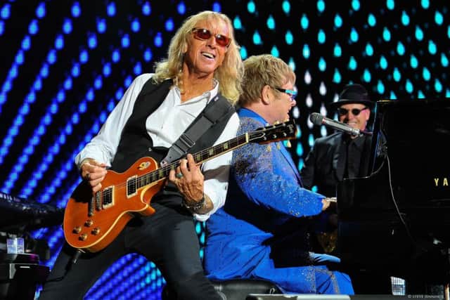 Elton John with guitarist Davey Johnstone. Picture: Steve Jennings