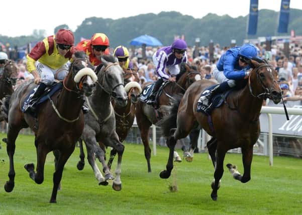 Syphax ridden by Jamie Spencer (left) beats Best of Days ridden by William Buick (right) to win the Tattersalls Acomb Stakes at last year's Ebor Festival.