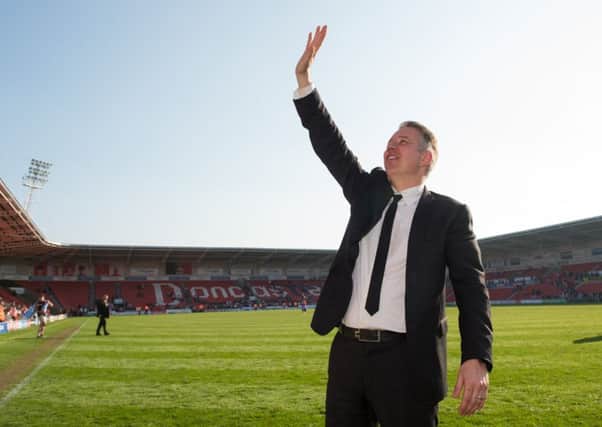 Doncaster Rovers' manager Darren Ferguson celebrates promotion last Saturday at the Keepmoat Stadium (Picture:: Jon Buckle/PA Wire).