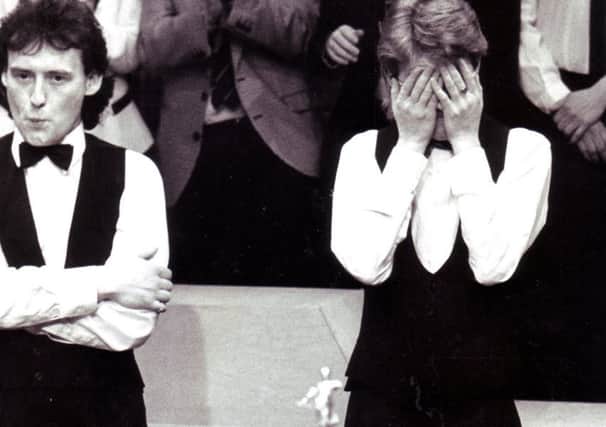 1990 - Stephen Hendry finds it all a bit much, while runner-up Jimmy White looks on. (Sheffield Newspapers).