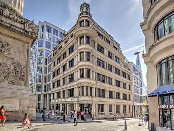 The new office scheme is close to the Monument  the column designed by Sir Christopher Wren as a memorial to the Great Fire of London