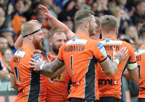 Castleford's players celebrate a try. Picture: Scott Merrylees
