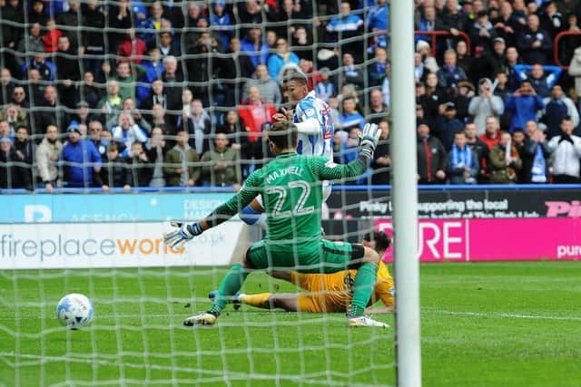 Huddersfield Towns Aaron Mooy had a late penalty saved but Collin Quaner slotted home the rebound, above, to give his side a 3-2 win over Preston North End (Picture: Jonathan Gawthorpe).