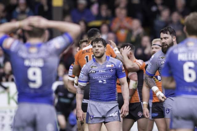 Wakefield's Scott Grix and team-mates show their dejection as their side slips to a heavy defeat by Castleford. Picture: Allan McKenzie/SWpix.com