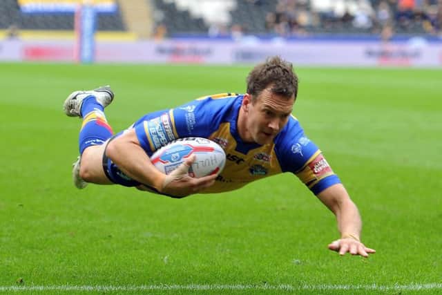 Leeds Rhinos' Danny McGuire dives over to score the first try of the match.
 Picture: Tony Johnson.