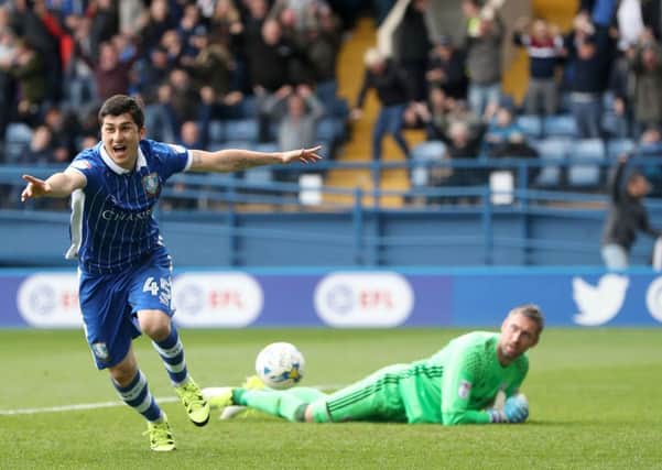 Sheffield Wednesday's Fernando Forestieri (left) scores his side's winning goal. Picture: Danny Lawson/PA.