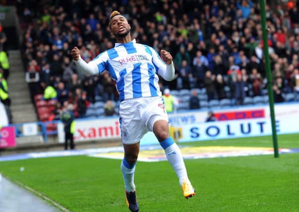 Huddersfield Town's Elias Kachunga celebrates making it 1-1.
 Picture: Jonathan Gawthorpe